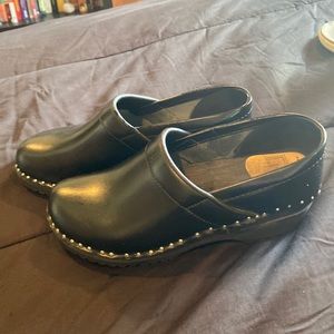 Black clogs with silver racks